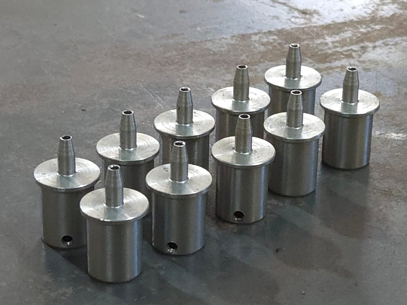 Nozzle sleeves with tapered tip